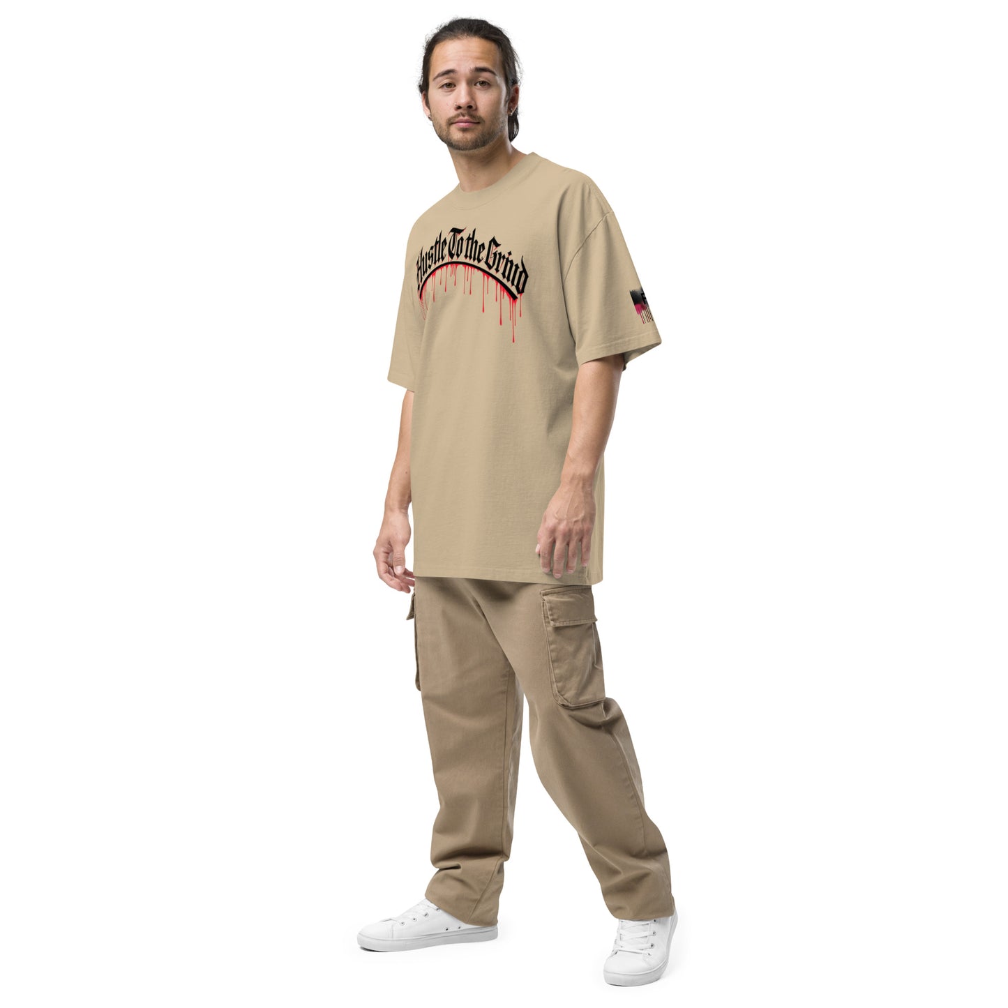 Oversized unisex T-shirt in faded bone color, featuring “Hustle to the Grind” streetwear graphic.