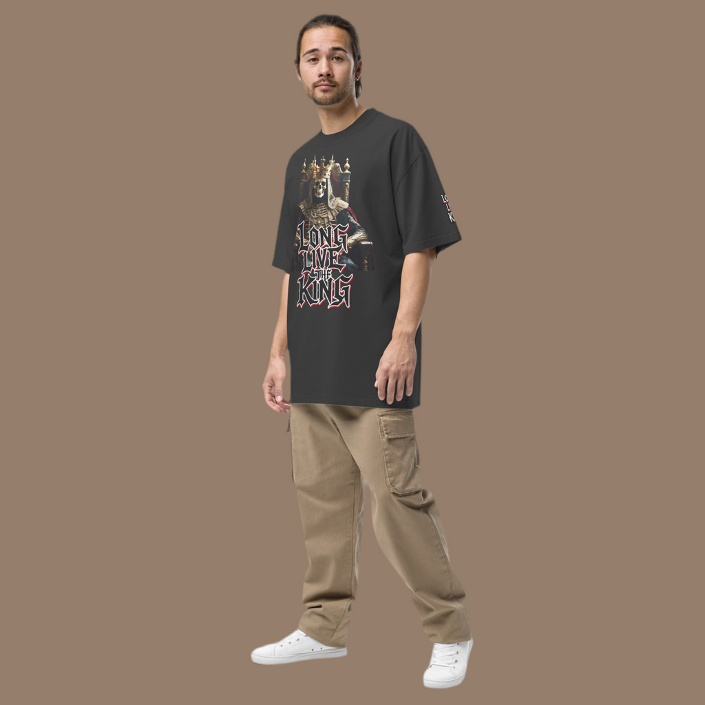 Front view of oversized gothic-style t-shirt featuring a crowned skeleton king on a throne with the graffiti text “Long Live The King” in red, white, and black