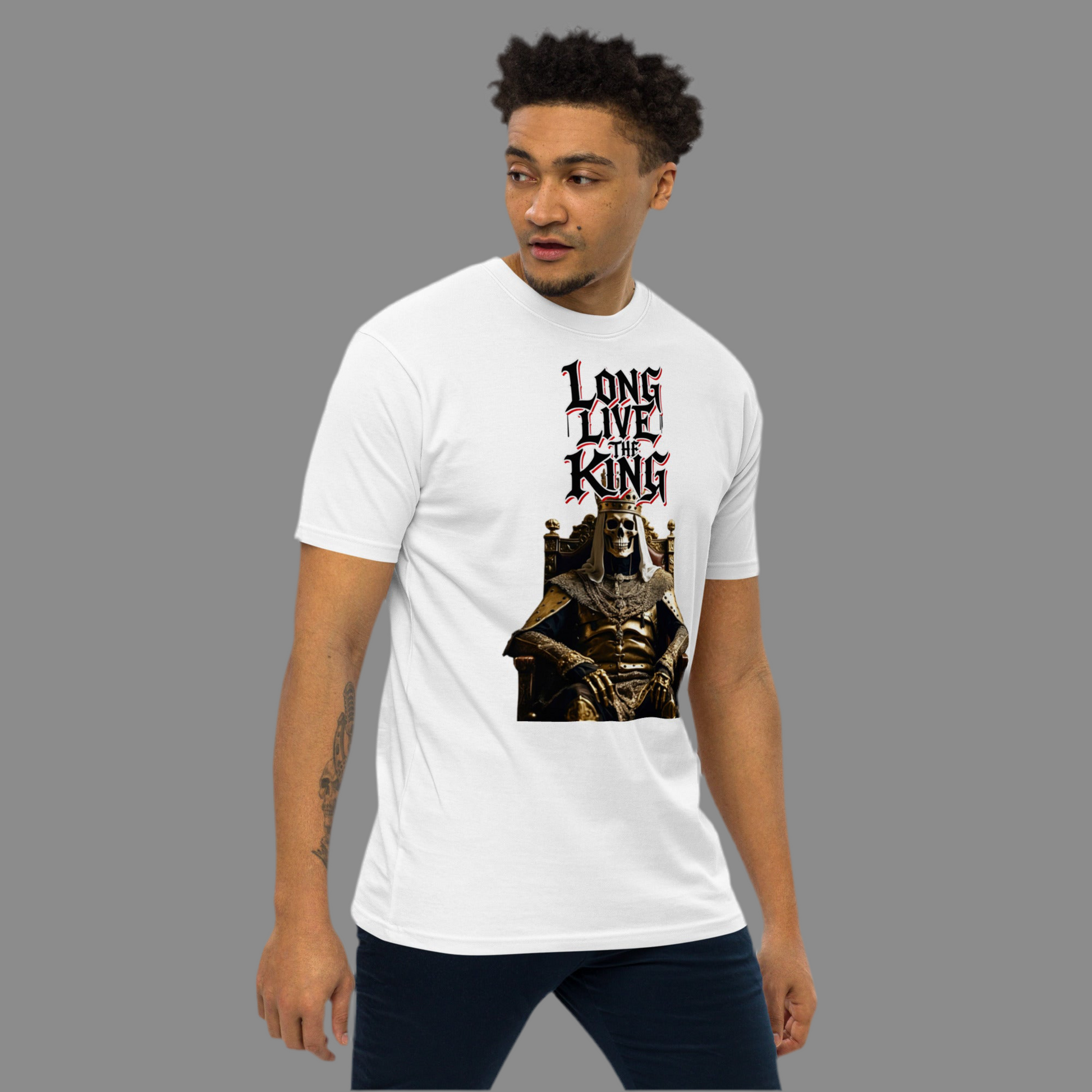 White premium t-shirt featuring gothic-style artwork of a golden skeleton king sitting on a throne with the graffiti slogan “Long Live The King” in bold red, white and black lettering