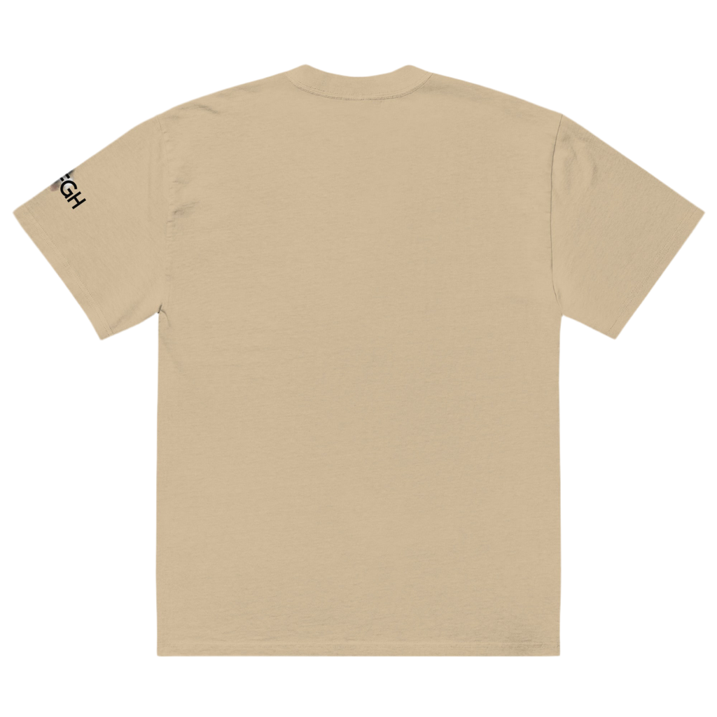 Oversized unisex T-shirt in faded bone color, featuring “Hustle to the Grind” streetwear graphic.
