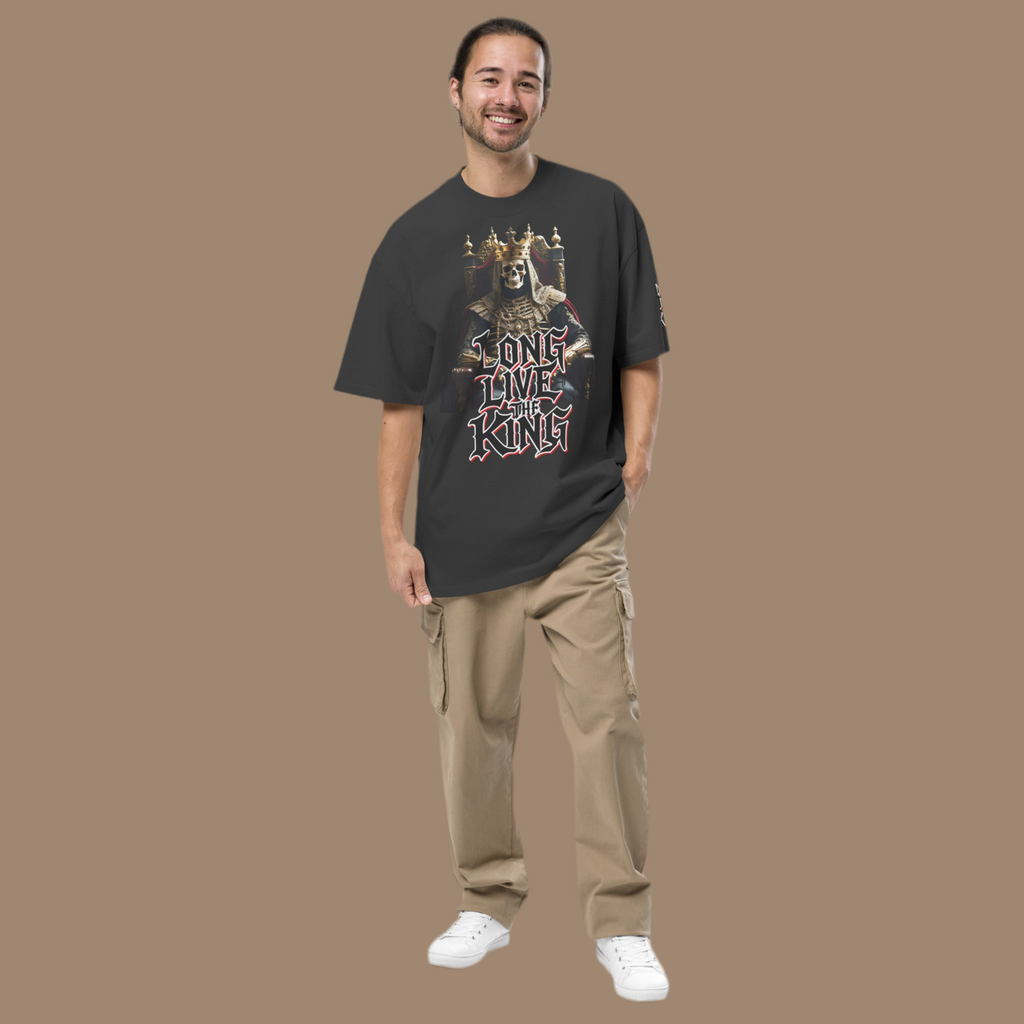 Front view of oversized gothic-style t-shirt featuring a crowned skeleton king on a throne with the graffiti text “Long Live The King” in red, white, and black