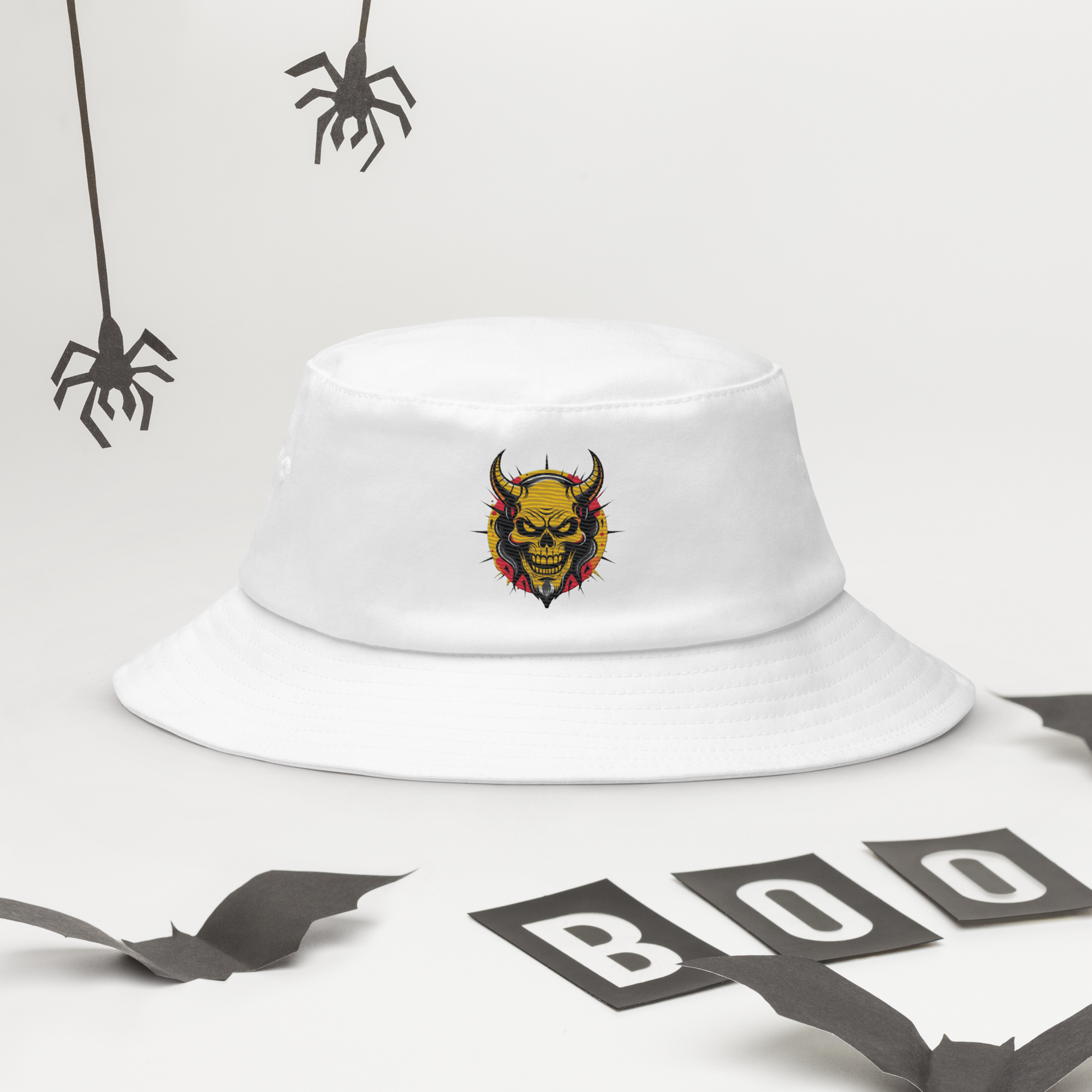 The Orange Devil Bucket Hat in black with bold embroidered graffiti devil design, shown from front view on neutral background
