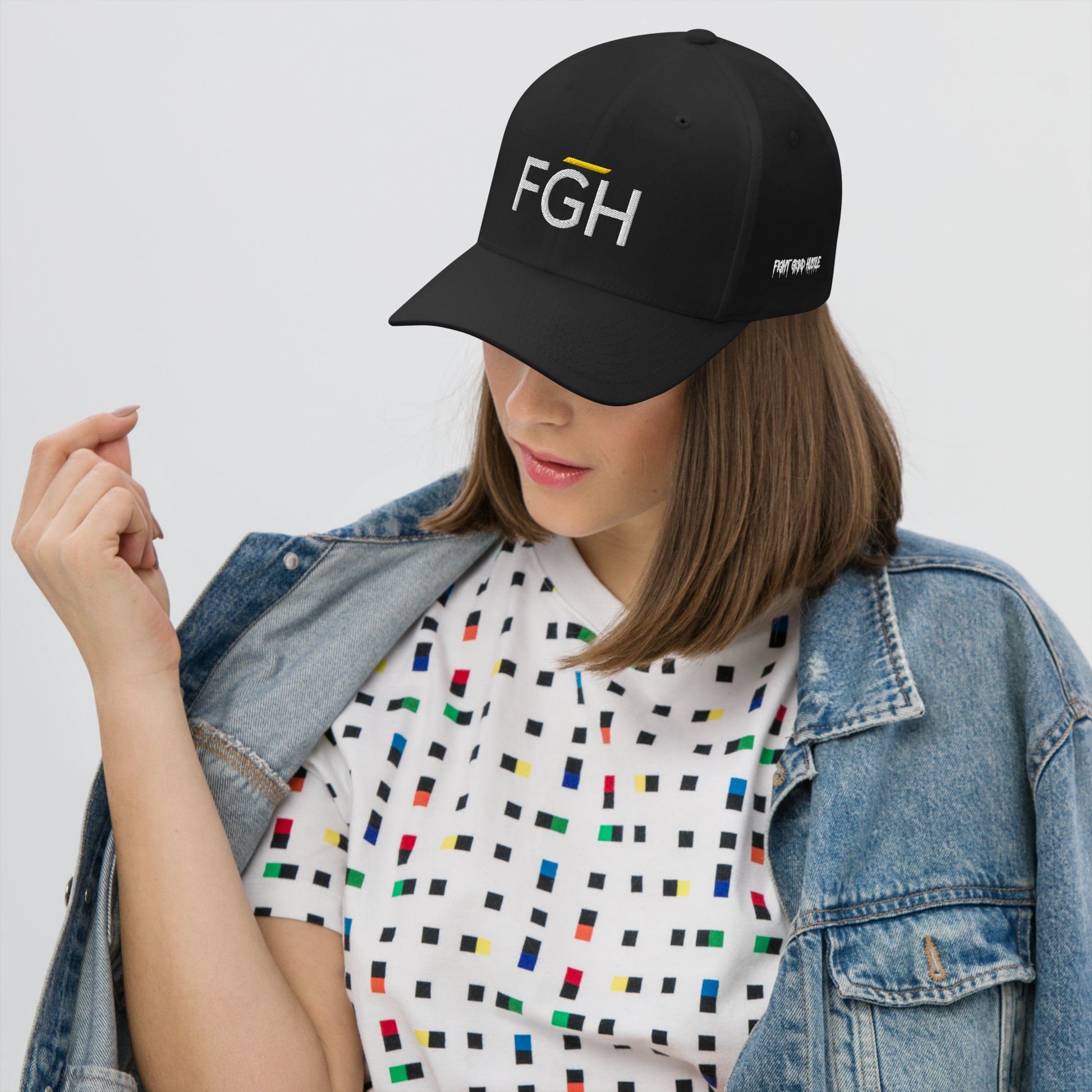 Black streetwear cap with embroidered “FGH” front logo and stitched “Fight Grind Hustle” side detail – premium Swiss urban headwear