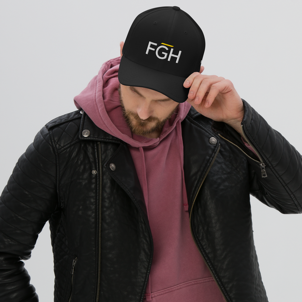 Black streetwear cap with embroidered “FGH” front logo and stitched “Fight Grind Hustle” side detail – premium Swiss urban headwear