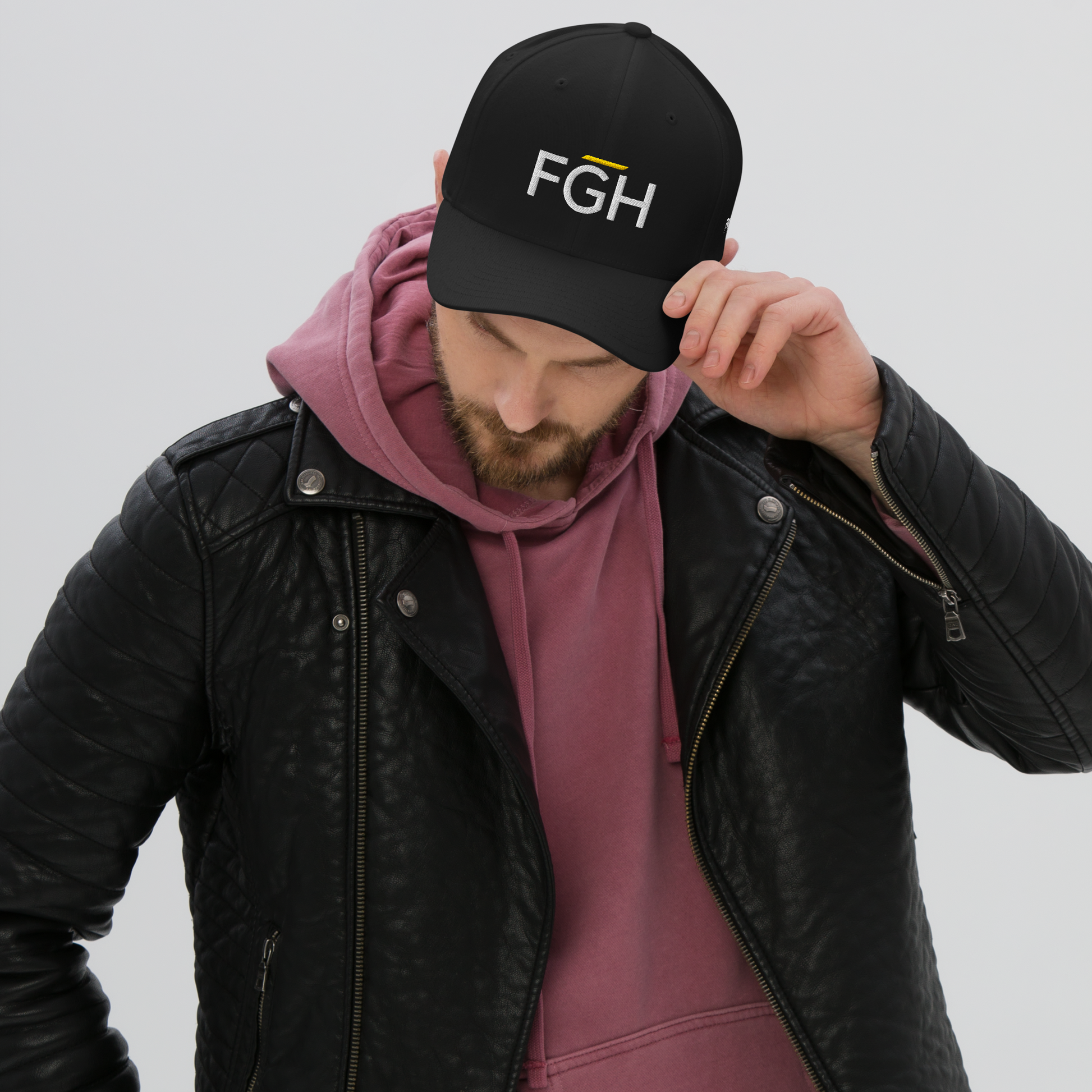Black streetwear cap with embroidered “FGH” front logo and stitched “Fight Grind Hustle” side detail – premium Swiss urban headwear