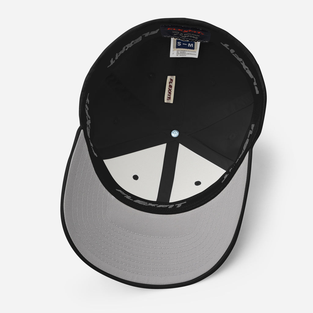 Dark Urban Hustle Flexfit cap featuring bold gothic print, premium streetwear accessory.