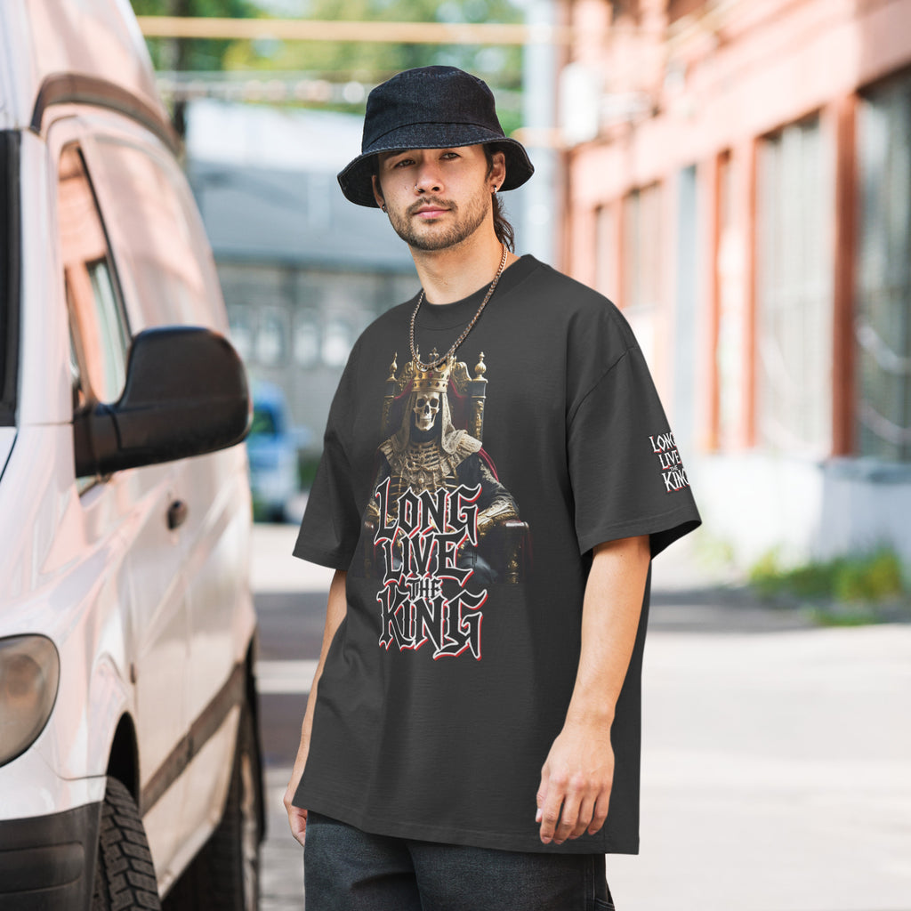 Front view of oversized gothic-style t-shirt featuring a crowned skeleton king on a throne with the graffiti text “Long Live The King” in red, white, and black