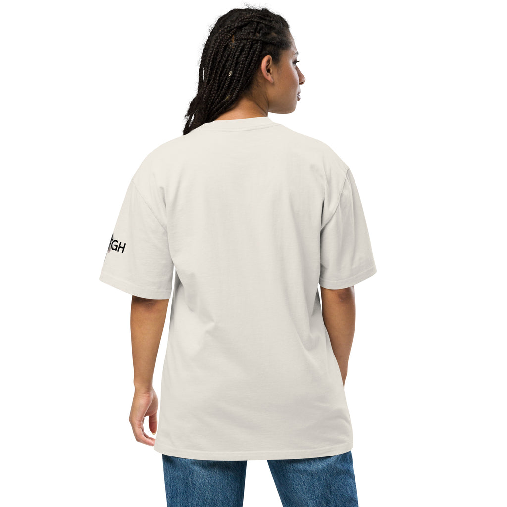 Oversized unisex “Hustle To the Grind” T-shirt in faded white, showcasing urban graffiti streetwear design.