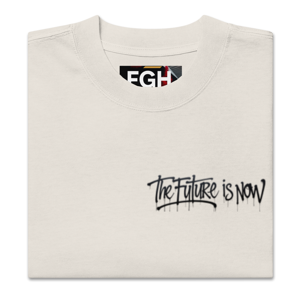 White - Beige - oversized t-shirt with bold front logo and large black-and-white backprint reading ‘THE FUTURE IS NOW’. Features close-ups of the graffiti-style typography, rear silhouette photo motif, and inner neck label. Unisex urban streetwear piece with boxy fit, dropped shoulders, and heavyweight cotton fabric.