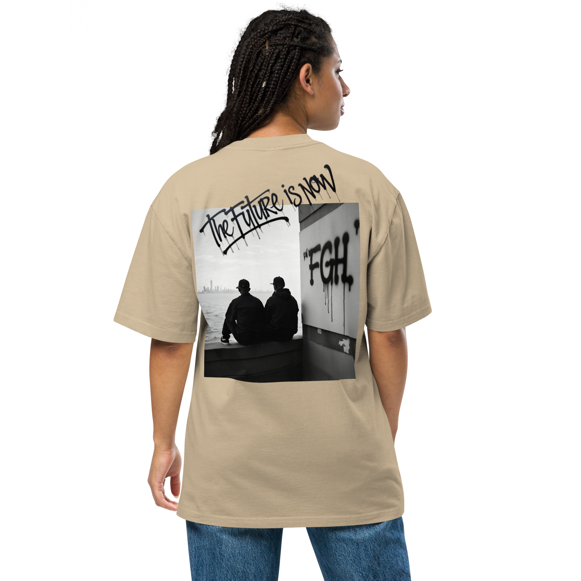 Two men in oversized faded t-shirts sitting by the waterfront, with bold FGH graffiti and a city skyline in the background – urban streetwear aesthetic.